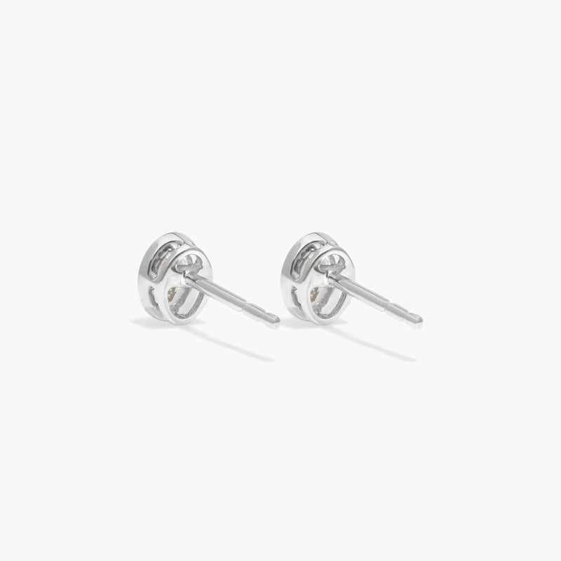 Bezel Diamond Stud Earrings With 0.25 CTW Oval Cut Diamonds in 14K White Gold